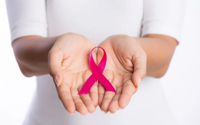 Cancer awareness ribbon representing early evaluation and specialist care for complex cancer cases
